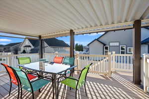 Deck featuring a residential view and outdoor dining space