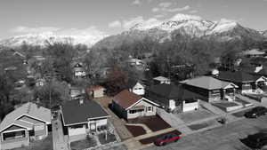 Drone / aerial view with a residential view and a mountain view