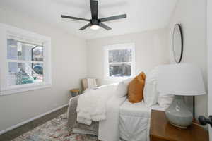 Bedroom with carpet floors, ceiling fan, and baseboards