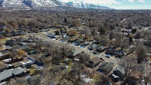 Birds eye view of property with a residential view and a mountain view