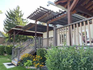 Pergola covered deck offers shade on those wonderful summer days