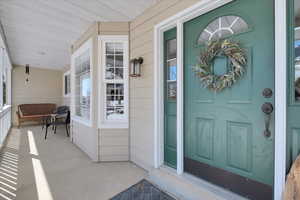 Entrance to property with a porch