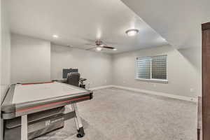 Game room featuring a ceiling fan, carpet, visible vents, and baseboards