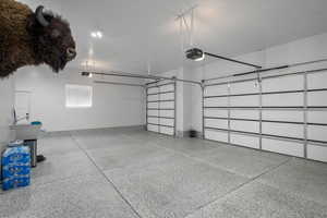 Garage featuring a garage door opener