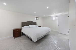 Bedroom with baseboards and recessed lighting