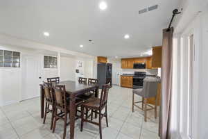 Dining area with recessed lighting, visible vents, baseboards, and light tile patterned floors