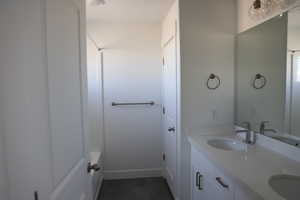 Bathroom featuring a sink and double vanity