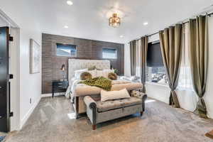 Bedroom with recessed lighting, visible vents, an accent wall, carpet flooring, and baseboards