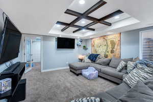 Living room with baseboards, coffered ceiling, carpet flooring, beam ceiling, and recessed lighting