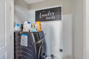 Washroom with laundry area and washer / clothes dryer