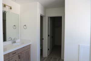 Bathroom featuring vanity and toilet