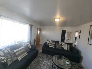 Living area featuring baseboards and wood finished floors