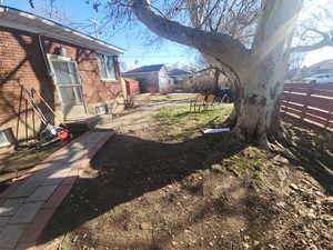 View Wast side of yard featuring fence