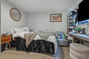 Bedroom featuring wood finished floors