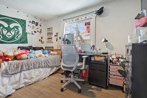 Bedroom with wood finished floors