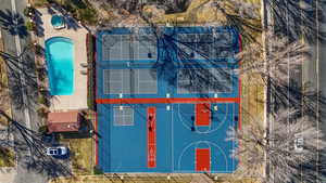 Aerial view of pool, pickleball, and basketball courts