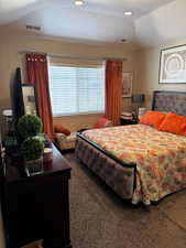 Bedroom with recessed lighting, carpet flooring, vaulted ceiling, and visible vents