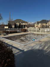 View of front of property with fence private yard and a residential view