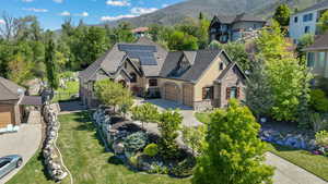 Birds eye view of property with a mountain view