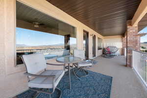 View of patio / terrace featuring a balcony, ceiling fan, and area for grilling