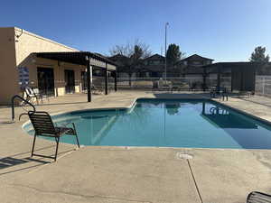 Pool with fence and a patio