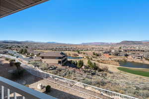 View of mountain feature featuring a water view and a residential view