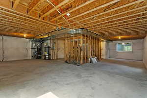 Basement with heating unit and gas water heater