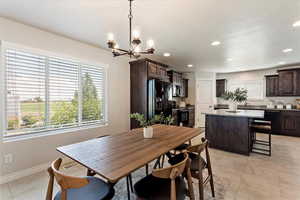 Dining area featuring baseboards, a wealth of natural light, and recessed lighting