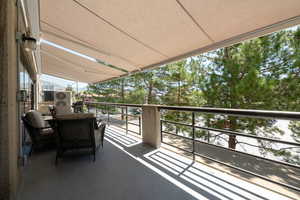 Lovely deck stretching the full length of the unit, with electric retractable awning.