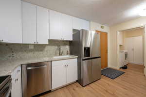 Newly renovated featuring stainless appliances and quartz countertops.