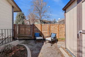 View of patio featuring fence