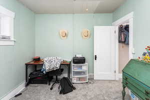 View of carpeted home office