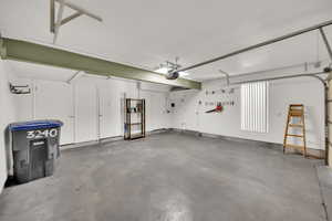 Garage featuring a garage door opener