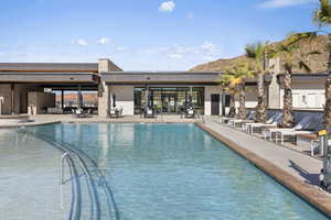 Community pool with a patio