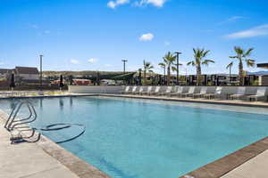 Community pool featuring fence