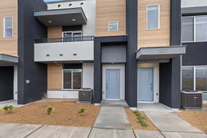 View of property featuring cooling unit