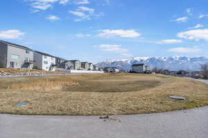 View of yard with a residential view and a mountain view