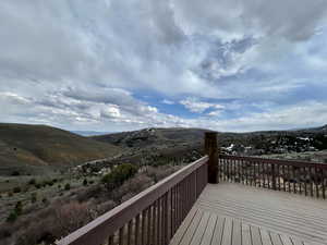 Wooden deck featuring a mountain view