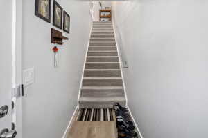 Stairs featuring baseboards and wood finished floors