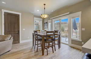 Dining space with baseboards, recessed lighting, visible vents, and light wood-style floors