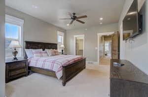 Bedroom with visible vents, baseboards, light colored carpet, a walk in closet, and recessed lighting