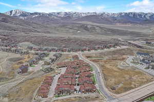 Birds eye view of property with a residential view and a mountain view