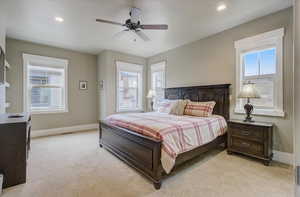 Bedroom with recessed lighting, baseboards, ceiling fan, and light colored carpet