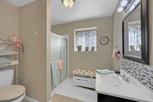 featuring plenty of natural light, walk in shower