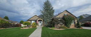 View of front of property featuring a front lawn