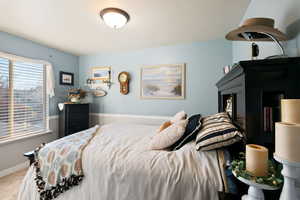 Bedroom with carpet flooring and baseboards