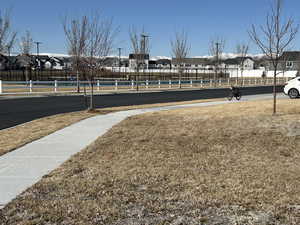 Surrounding community with fence and a residential view