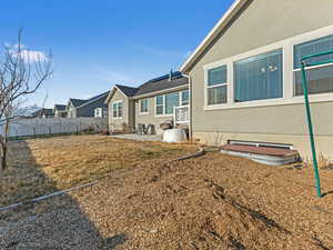 View of yard with a patio area, a residential view, and fence