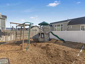 View of jungle gym with fence