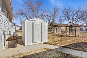 View of shed with fence